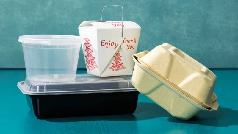 A damaged plastic container with pitted rings from heating sugary and fatty foods.