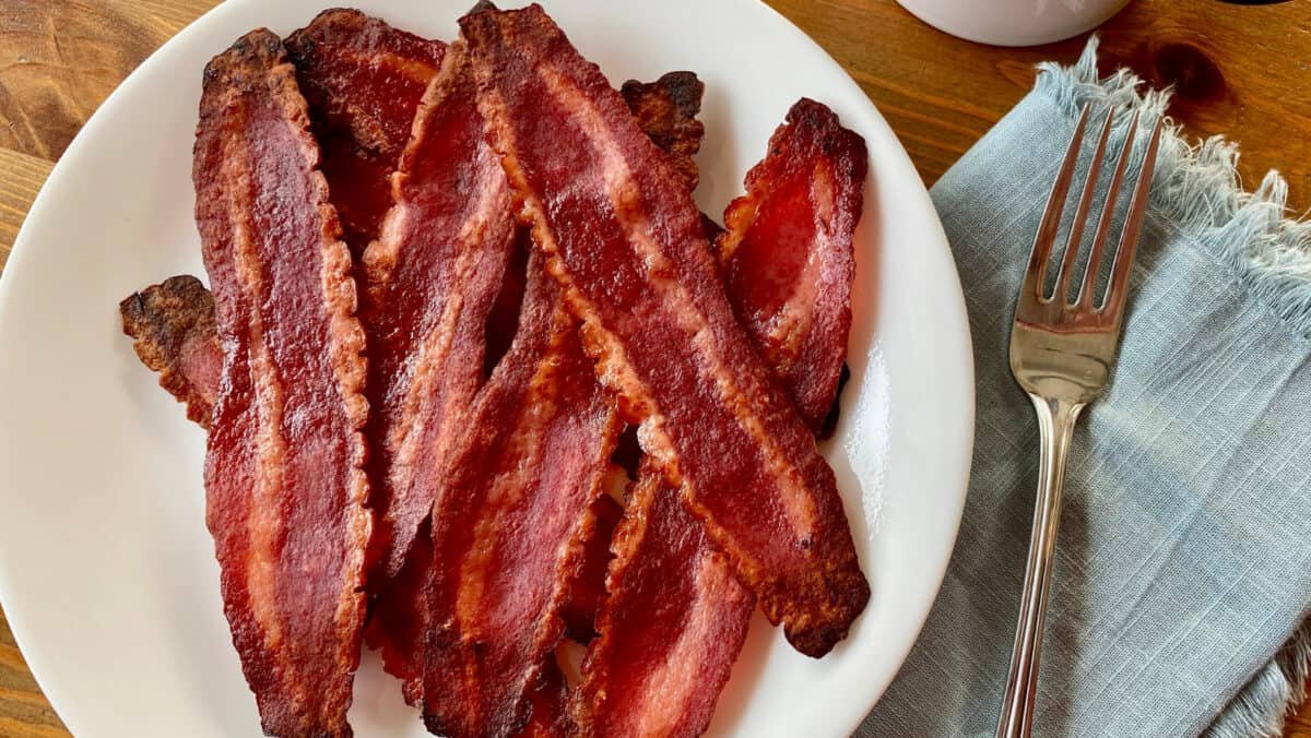 Crispy cooked turkey bacon strips served on a clean plate ready for breakfast.