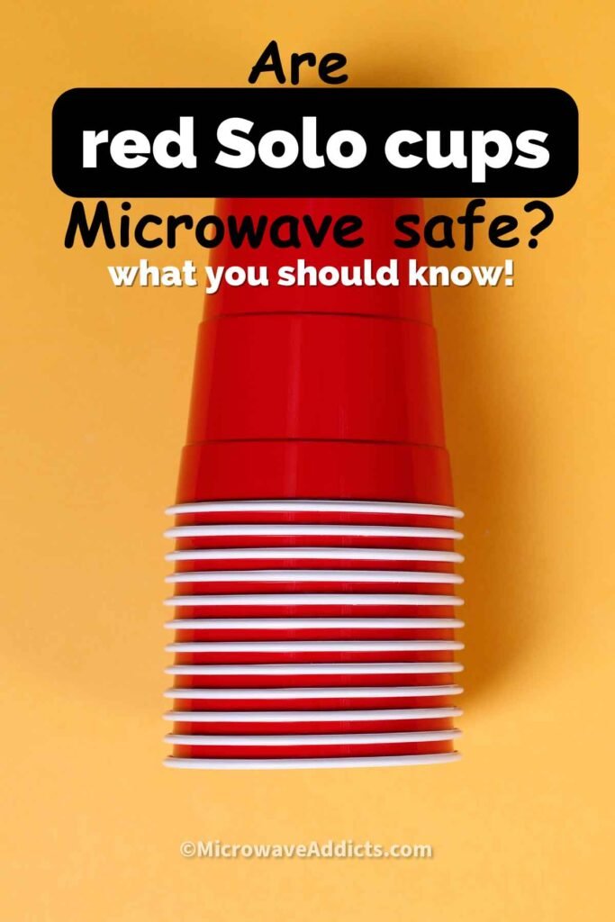 A steaming ceramic mug sits safely on a table next to a microwave.
