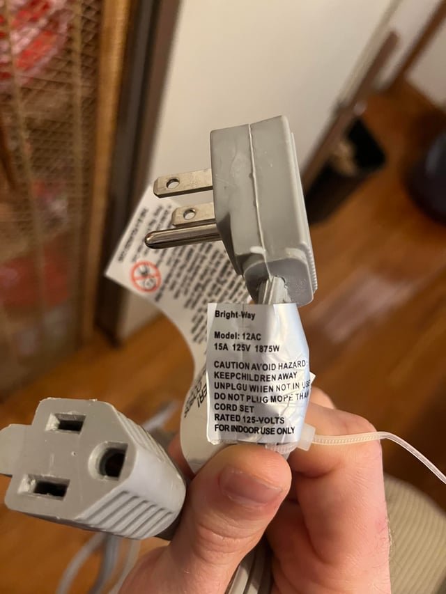 An empty wall outlet in a kitchen represents the safest power source for appliances.