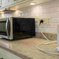 can you plug a microwave into a surge protector